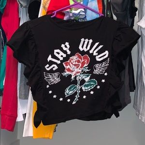 A crop top shirt that says stay wild